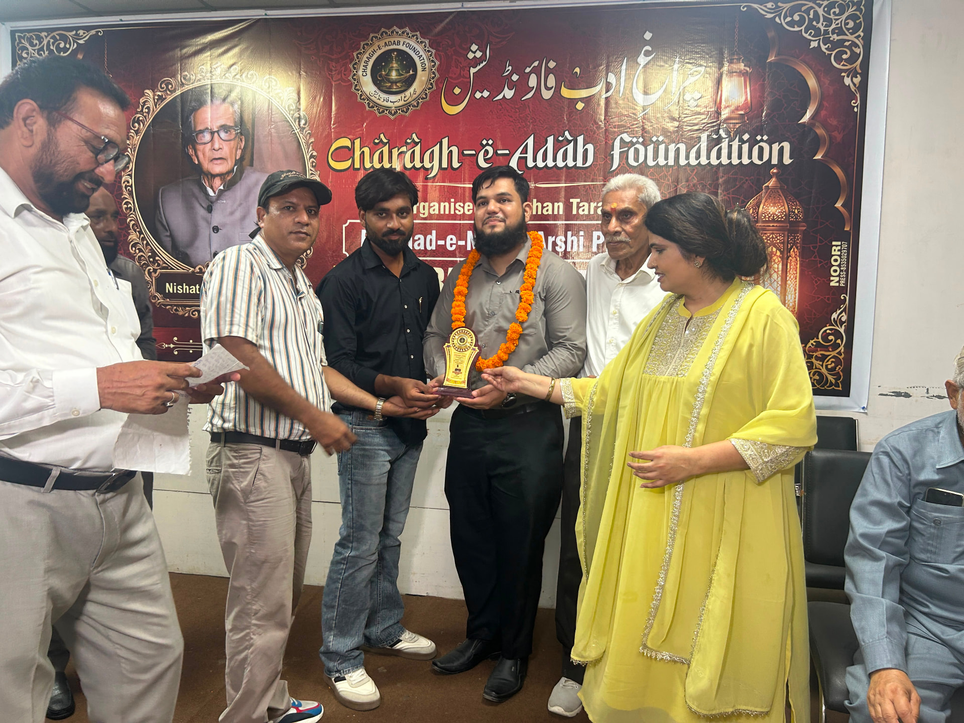 Fardeen Ahmad Khan receiving a literary award at a Charagh-e-Adab Foundation gathering